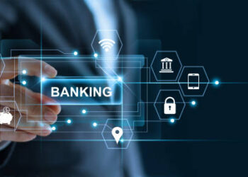 Hombre de negocios que sostiene la palabra de banca en la mano con el icono de conexión de red en la pantalla virtual de fondo oscuro
